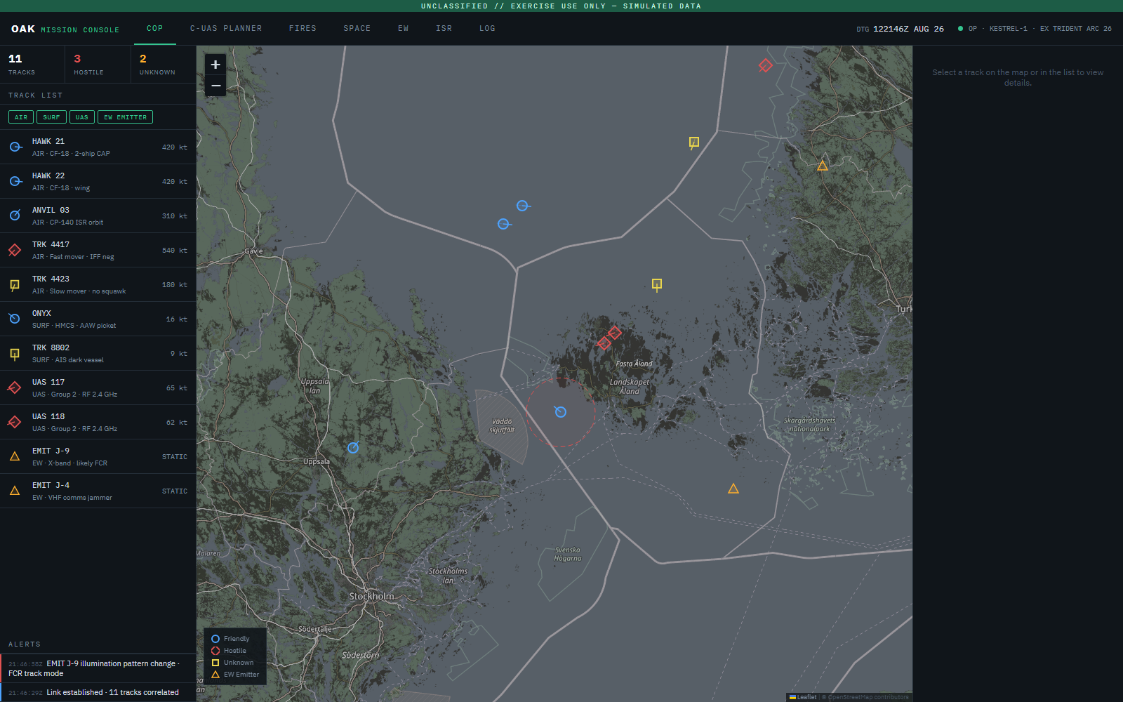 OAK Mission Console — Common Operational Picture: air, surface, UAS and EW tracks over a littoral exercise box with a ship weapons-engagement zone